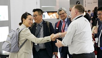 a man and a woman hand shake in the WTCE exhibit