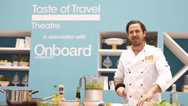 A chef prepares some food in the Taste of Travel Theatre at WTCE